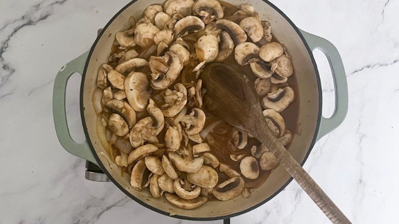 mushrooms and broth in large skillet