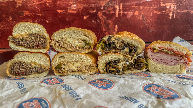 four Jersey Mike's sandwiches cut in half