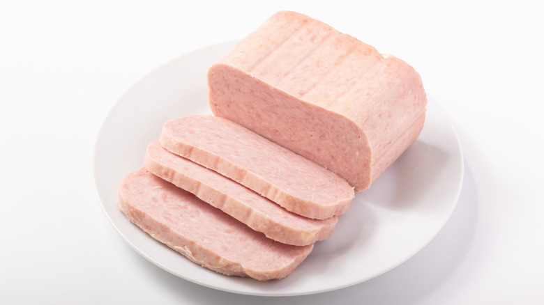 uncooked sliced spam on plate