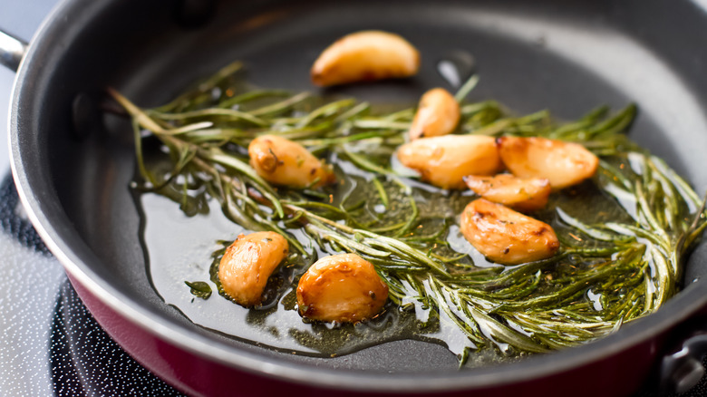 Garlic cooked with oil and rosemary