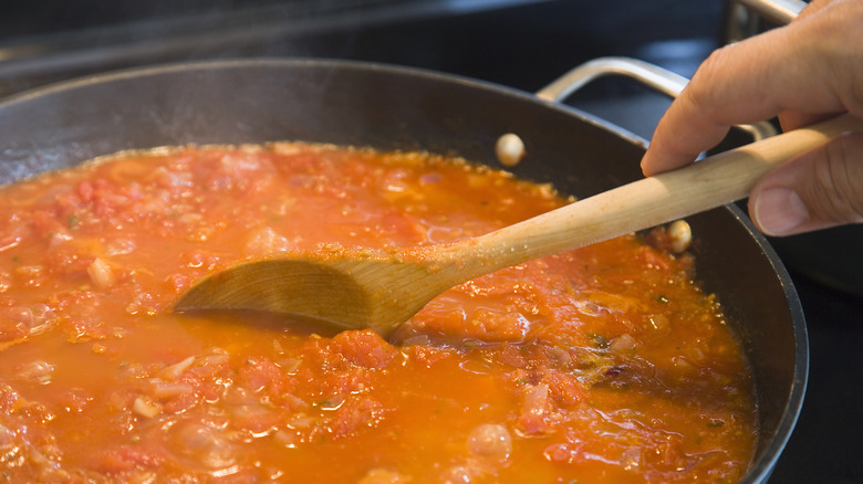 Tomato sauce simmering in pan.