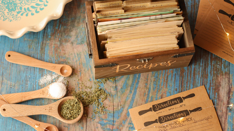 box of recipe cards and ingredients on table