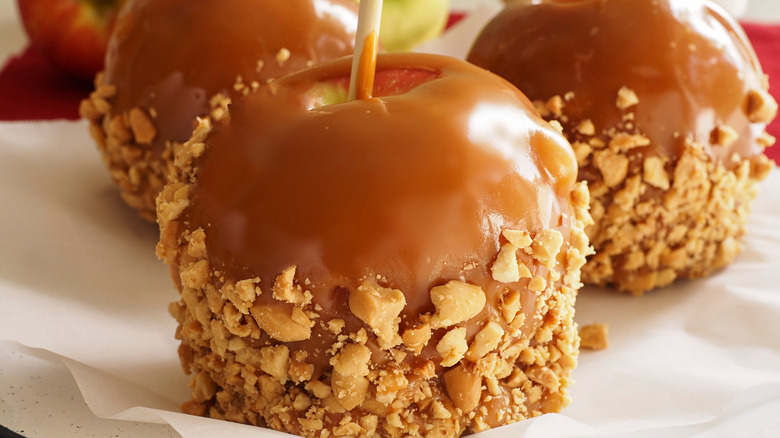 three caramel apples