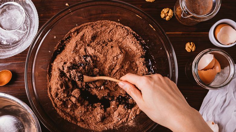 hand mixing brownie ingredients 