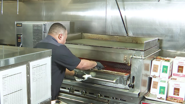 Chef using Ruth's Chris broiler