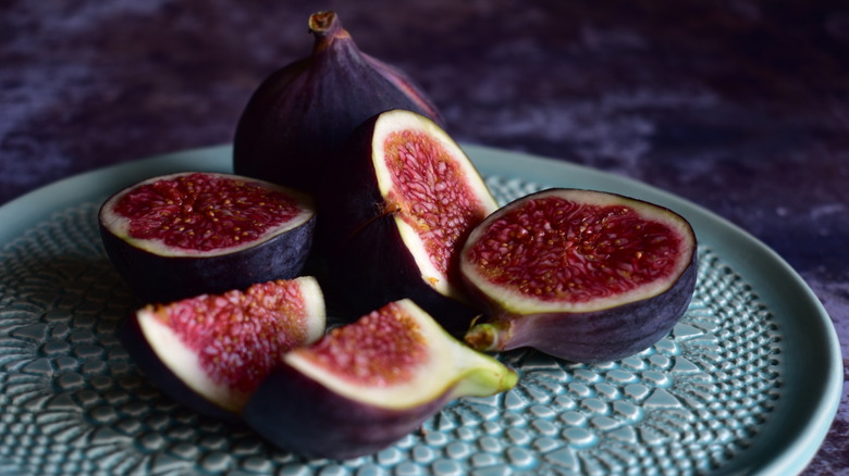 Sliced figs on plate