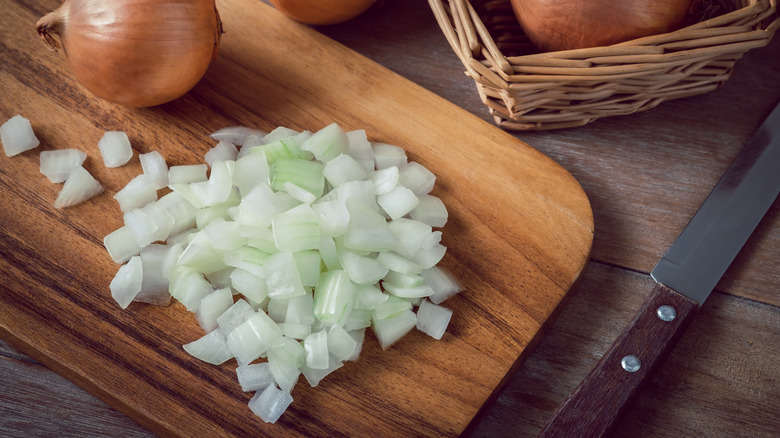 Chopped onions on cutting board