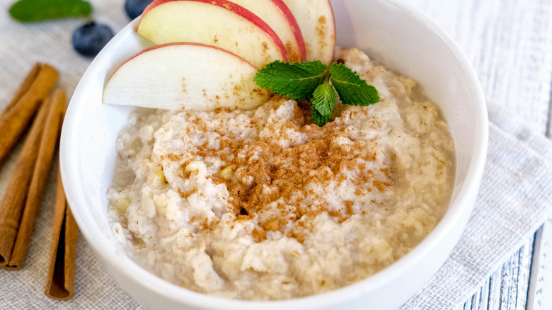 bowl of oatmeal with apple slices