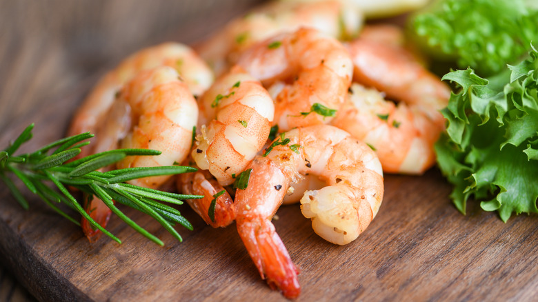 Grilled shrimp on cutting board