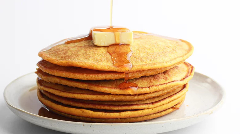 pumpkin pancakes on plate with butter