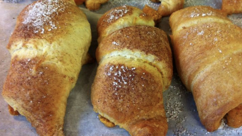 pumpkin crescent rolls on baking sheet