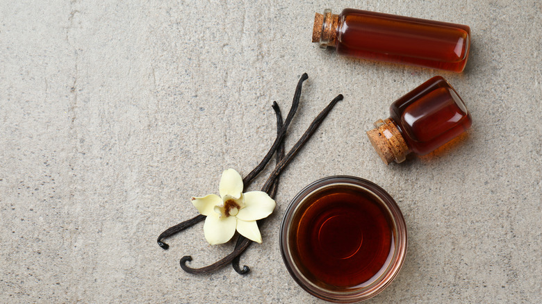 Vanilla extract bottles and vanilla beans