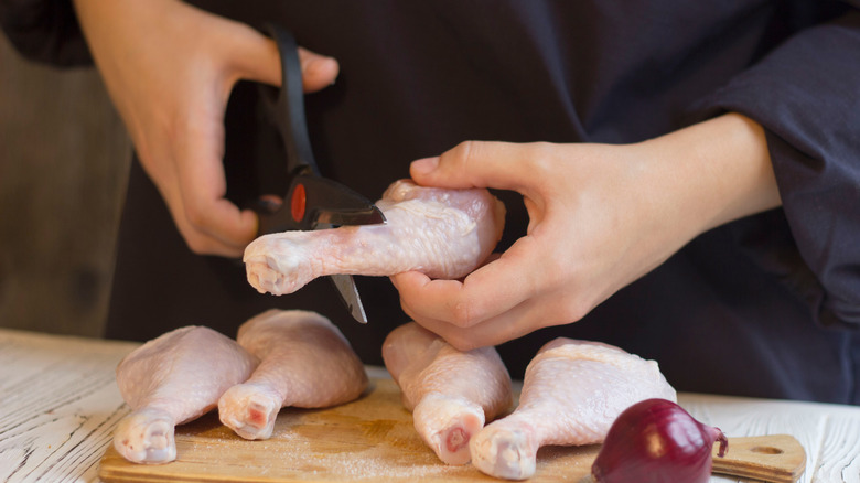 poultry scissors cutting chicken