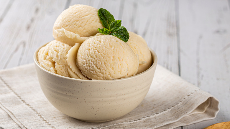 Bowl with scoops of vanilla ice cream