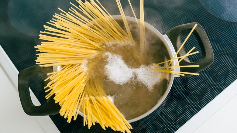 boiling pot of spaghetti noodles