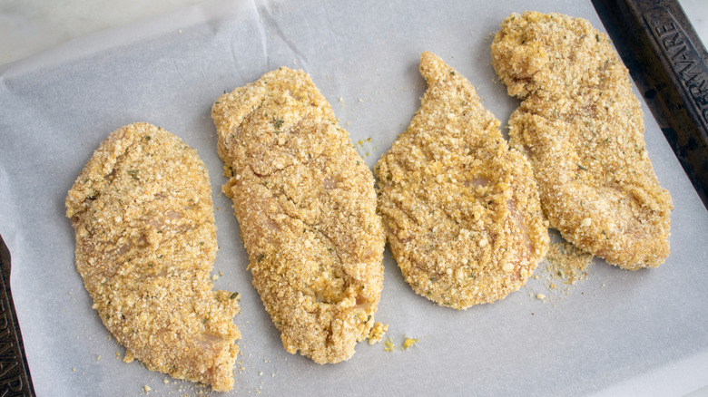 raw, breaded chicken cutlets