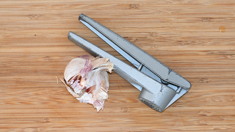 Why You Shouldn't Peel Your Garlic When You Use a Garlic Press