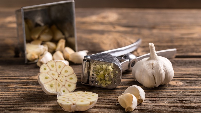 Garlic press on board