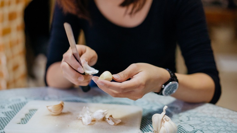 Woman peeling garlic