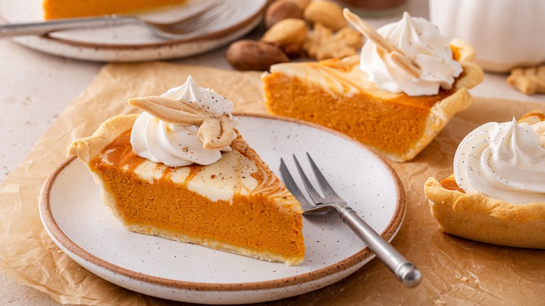 pumpkin pie slice with whipped cream