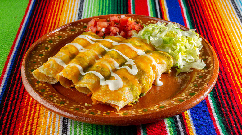 Enchiladas with lettuce and tomatoes