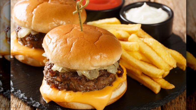 burgers with fries and sauce