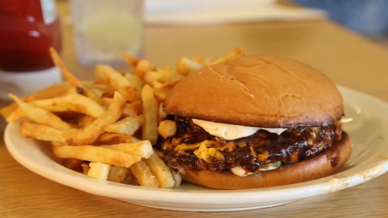 burger with fries on plate