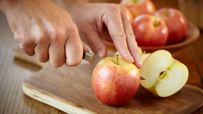 Fresh apple being sliced