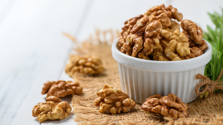 Ramekin full of shelled walnuts