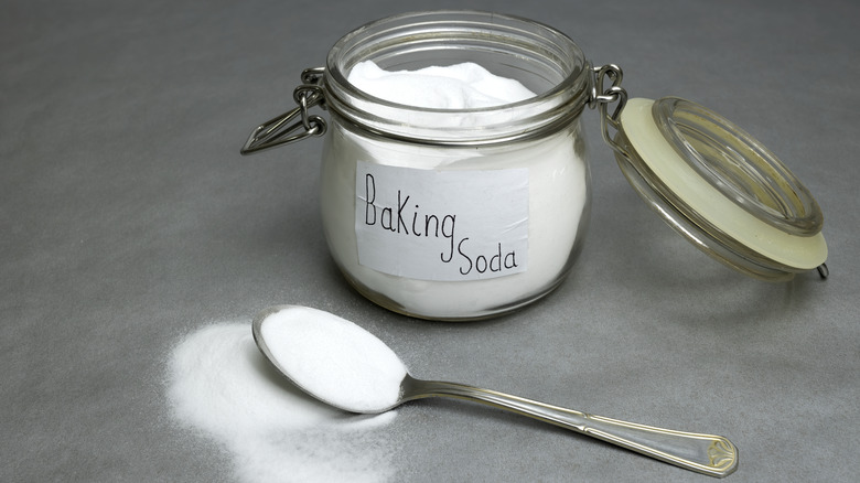 baking soda in labeled glass jar with spoon