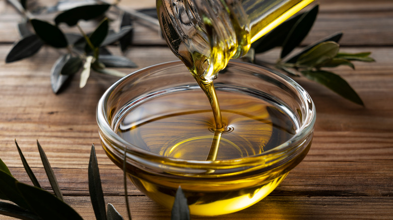 cooking oil poured into glass bowl