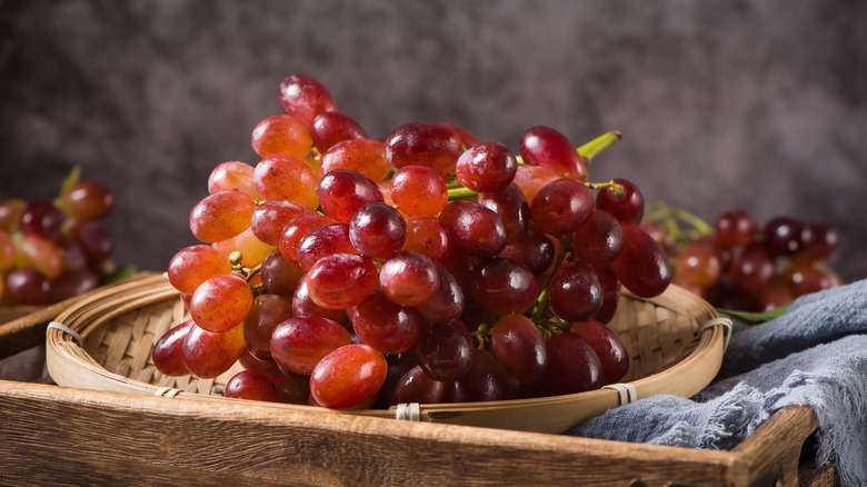 red grapes on wood table