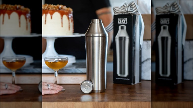 Silver cocktail shaker and drink