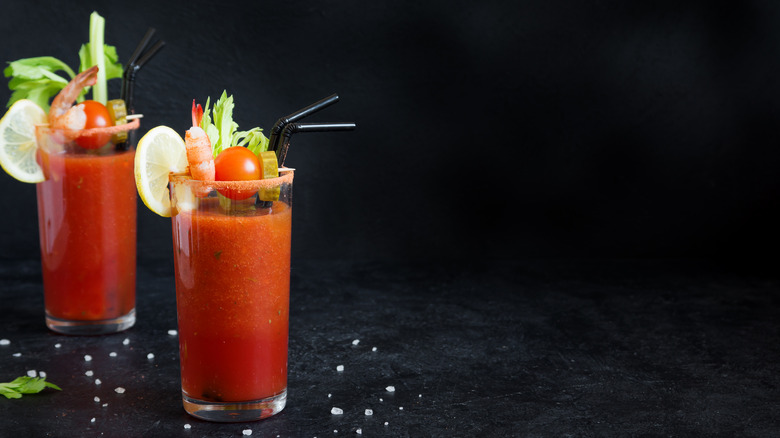 Two Bloody Mary's with garnishes
