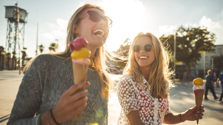 Two women eating ice cream cones