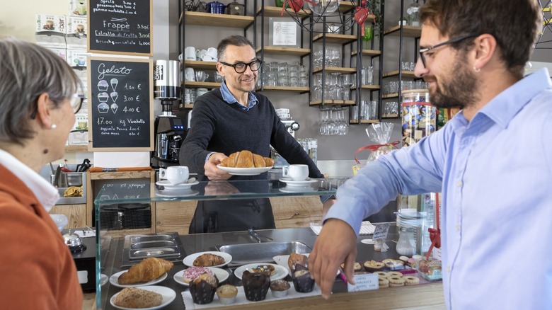 Coffee and croissants at counter