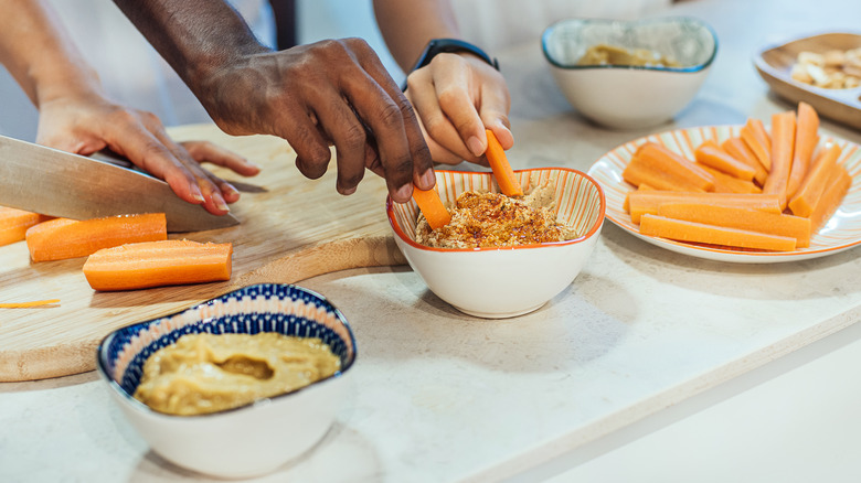 Carrots dipped in hummus