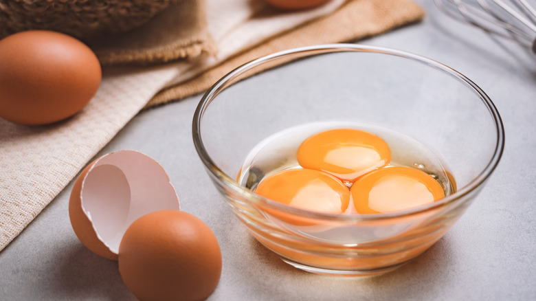 cracked eggs in bowl 