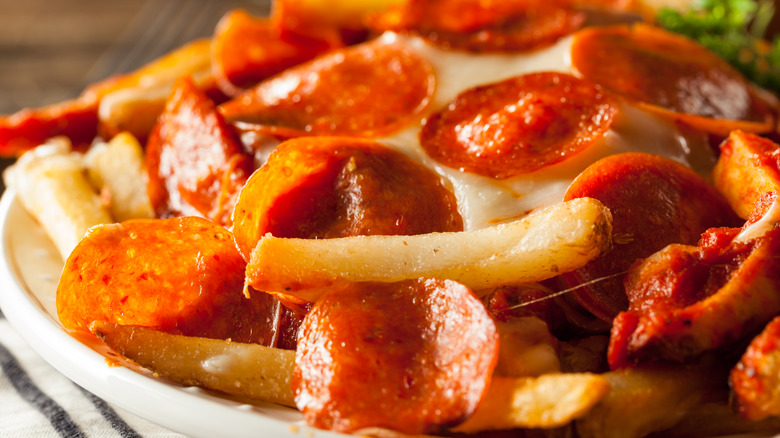 Pizza french fries on plate