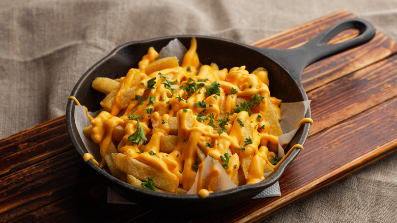 Cheesy fries in cast iron skillet