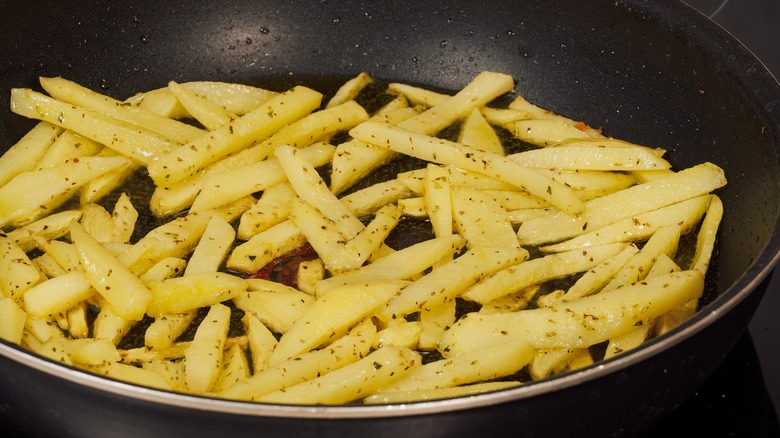 Seasoned french fries in pan