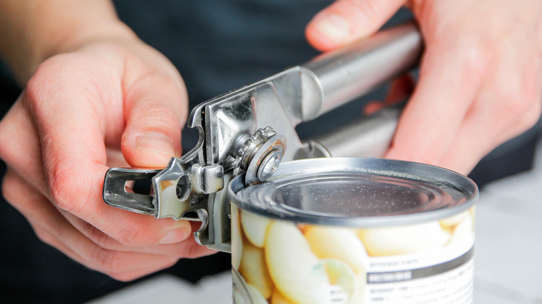 can opener on canned garlic