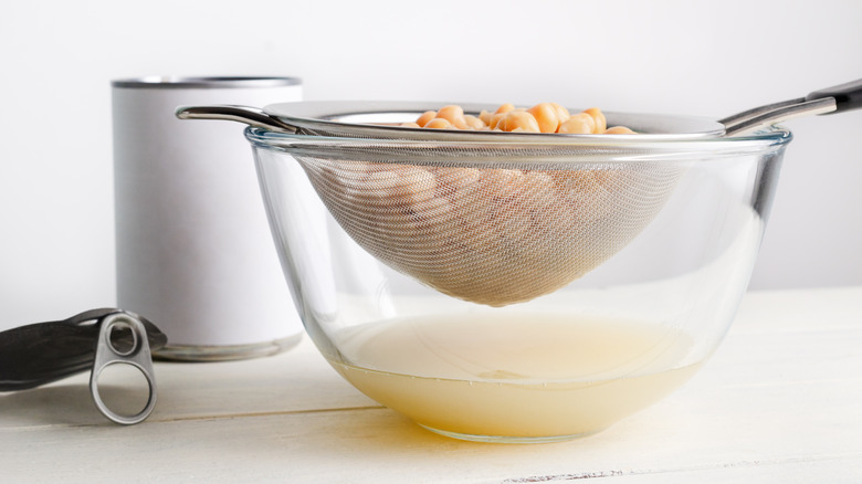 canned chickpeas draining in strainer