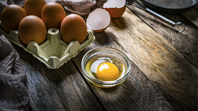 Egg cracked into ramekin