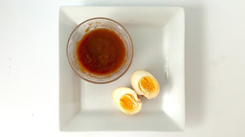 Tomato sauce-marinated hard-boiled egg