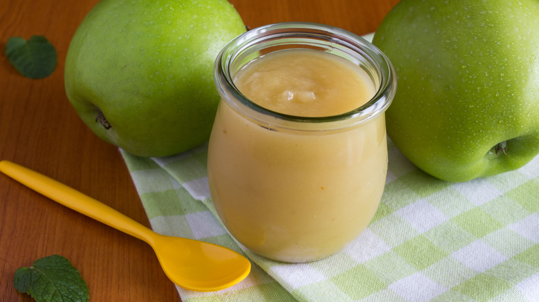 Glass jar with applesauce