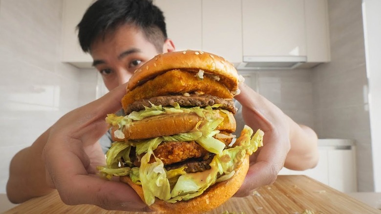 man holding huge burger