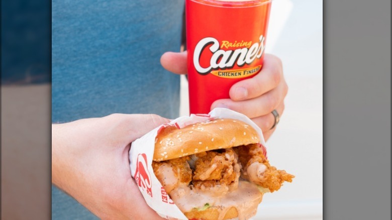 Raising Cane's chicken sandwich and soda cup