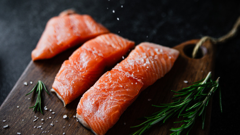 Raw salmon fillets with spices