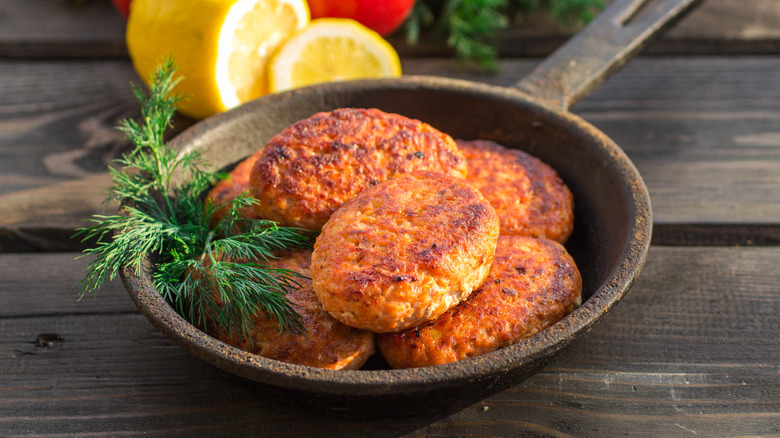 Salmon fishcakes in skillet